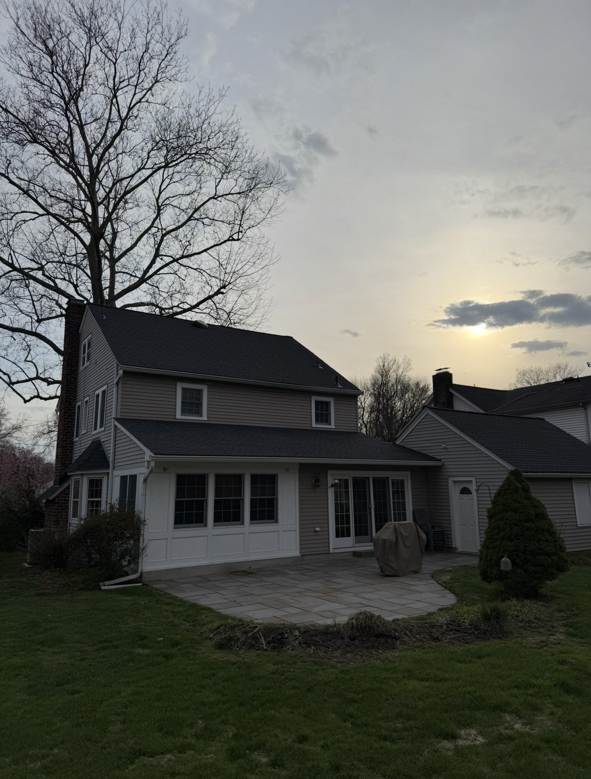 Back of home at dusk after re-roof