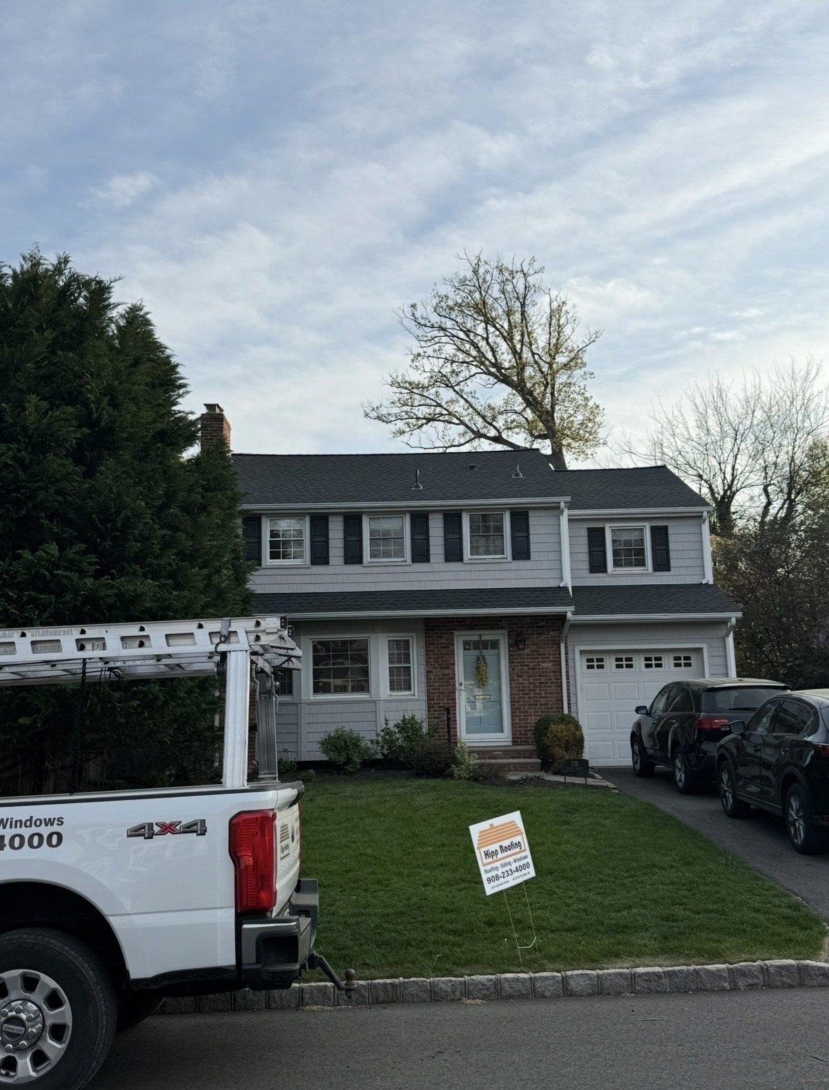Hipp Roofing yard sign at completed job