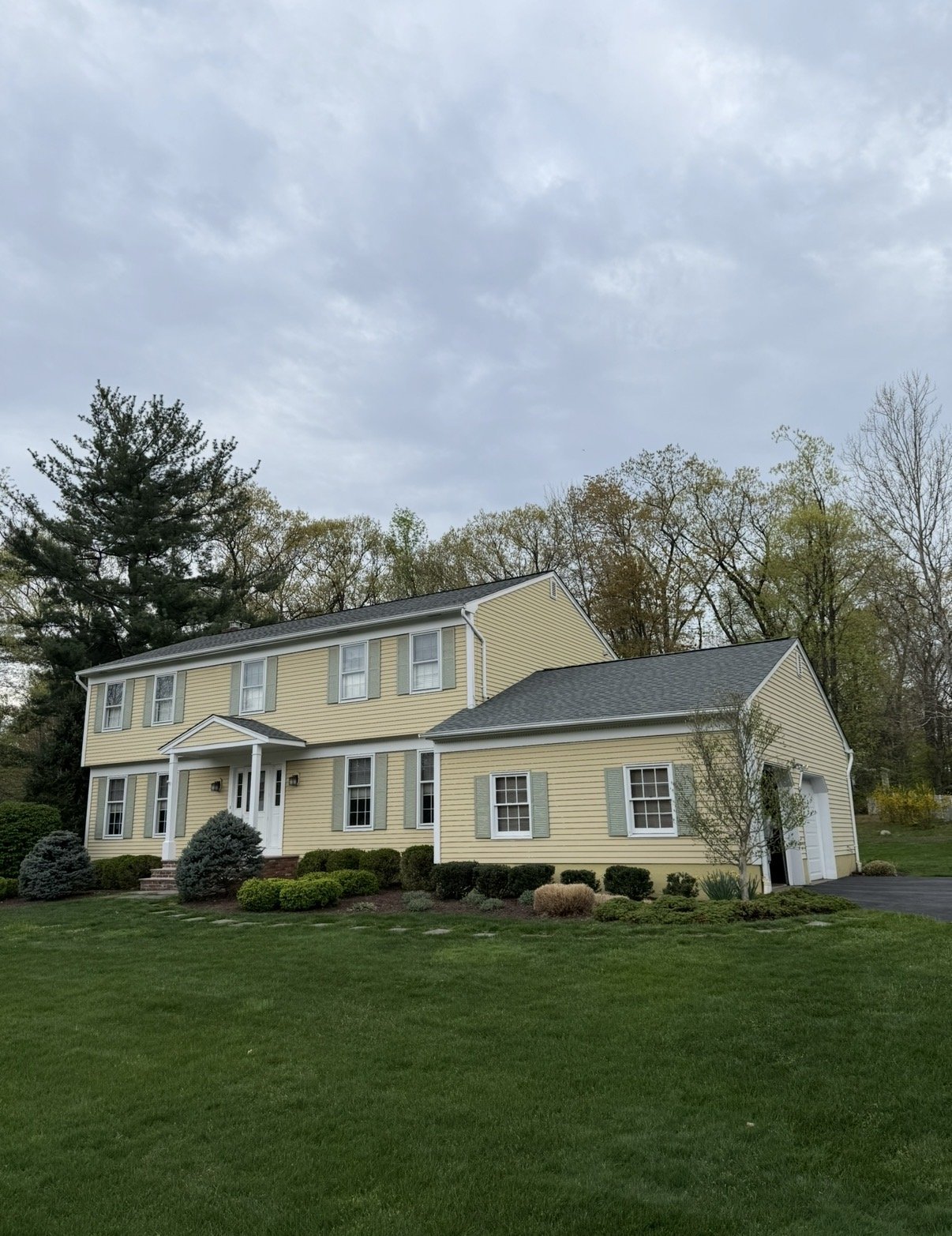 Yellow colonial with new roof